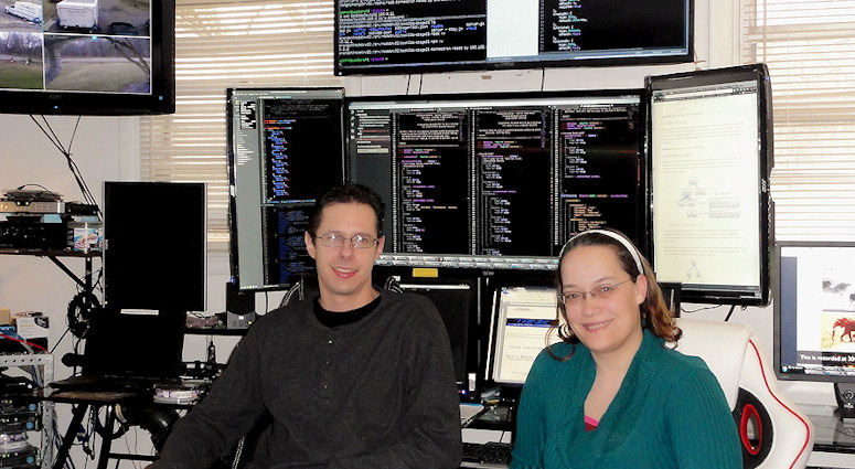 Brandon and Katie in office developing websites and software